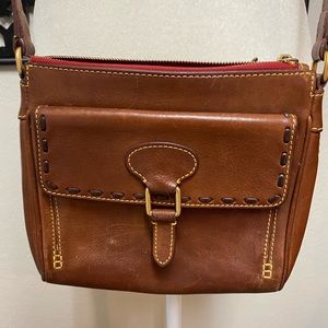 Cognac Dooney & Bourke crossbody or shoulder bag.